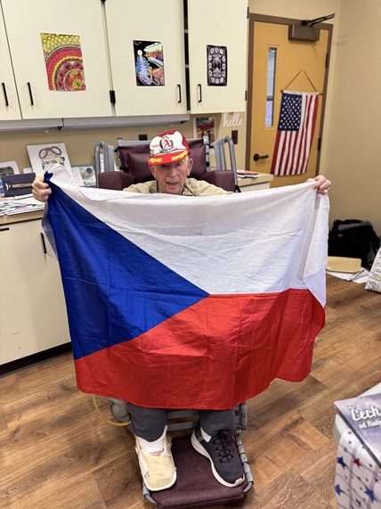 Antonín Fajkus holding the Czech flag.