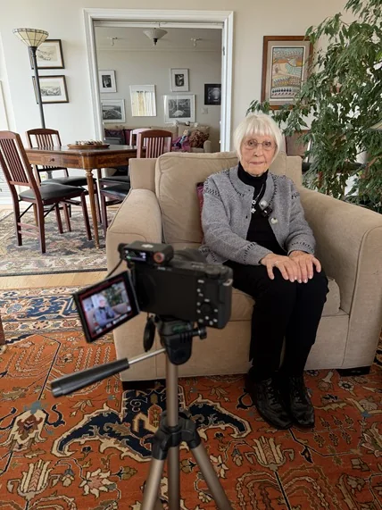Eva Kessner seated during the recording of her testimony for Witnesses of War.