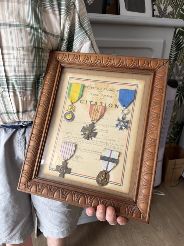 Germain Malaterre’s military decorations displayed with his citation.