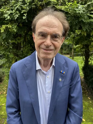 Portrait of Ronald Waterman in a garden.