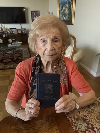 Rosalie Simon holding a Czechoslovak passport.